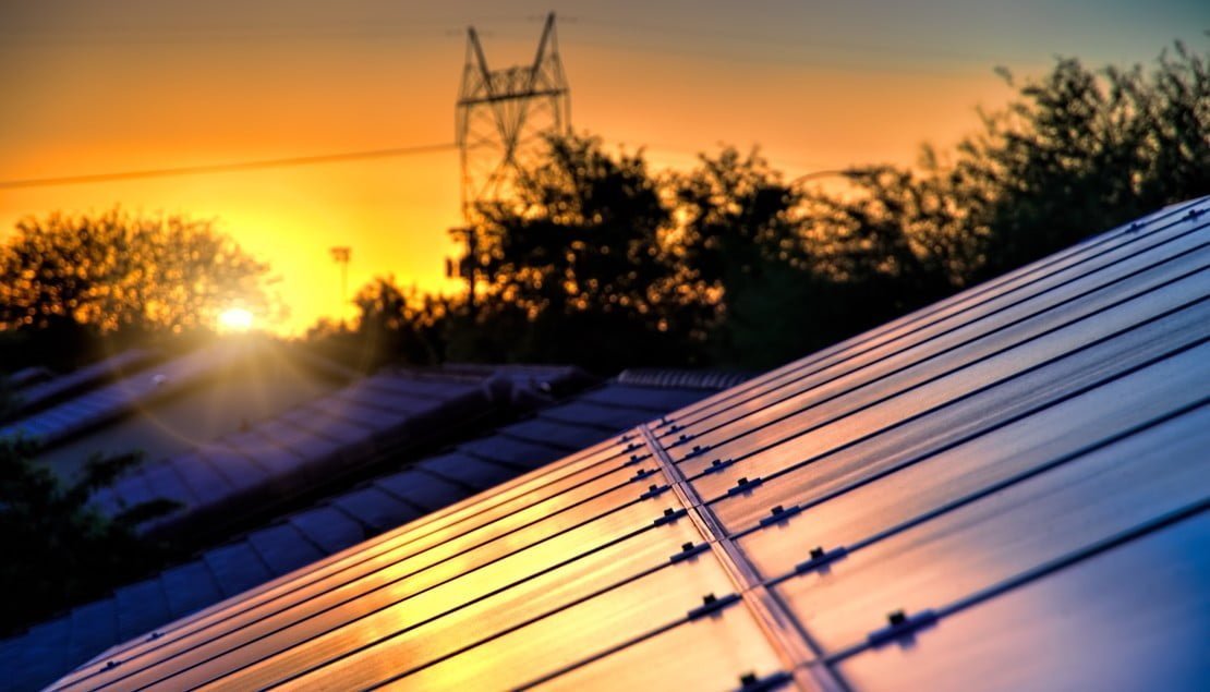 high power electric lines ruin the sunset but my solar panels capture Community Batteries are Helping Neighbours in Australia Share Energy – Here’s How