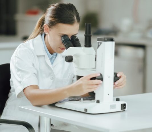 scientist analyzing science experiment laboratory test looking at microscope laboratory research t20 A9Za71 Scientists Have Created A Molecule That Can Store Solar Energy For 18 Years