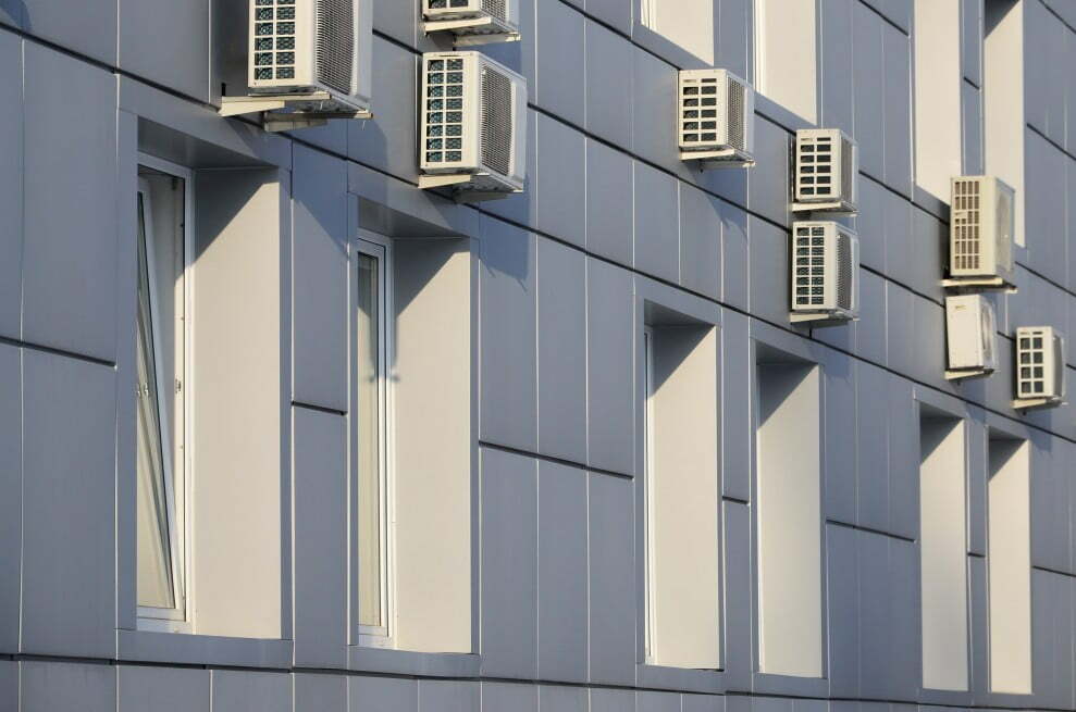 gray wall of office building made of metal plates with windows and air Carbon-Negative Construction