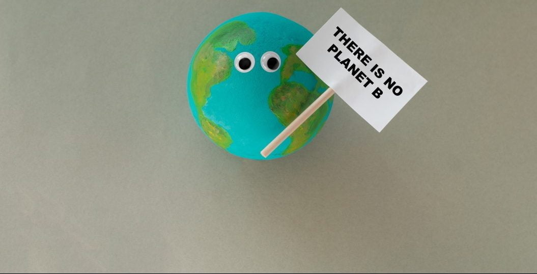 a small handmade model of planet earth with googly eyes holds a sign that says there is no planet t20 0xYPgB e1667602752626 Earth Day 2022: Everything you Need to Know About Earth Day