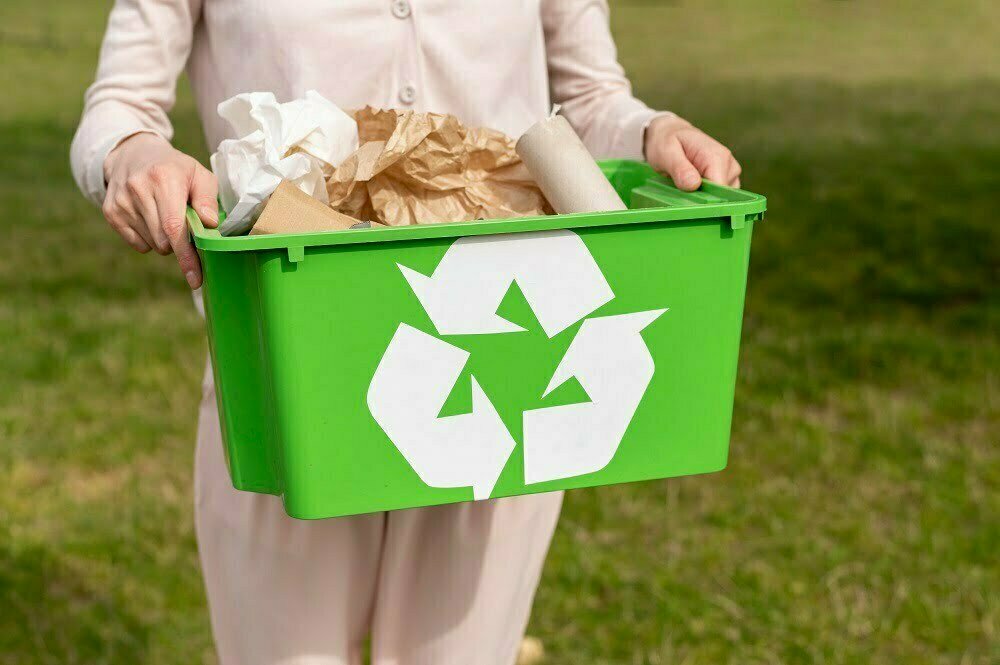 woman holding recylcing basket Why is Skip Bin Hire Essential for Waste Management?