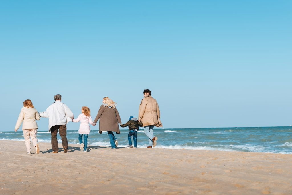 envato back view of multigenerational family walking on b 2021 08 31 03 47 32 utc Can Baby Boomers help Gen Z fix the Climate?