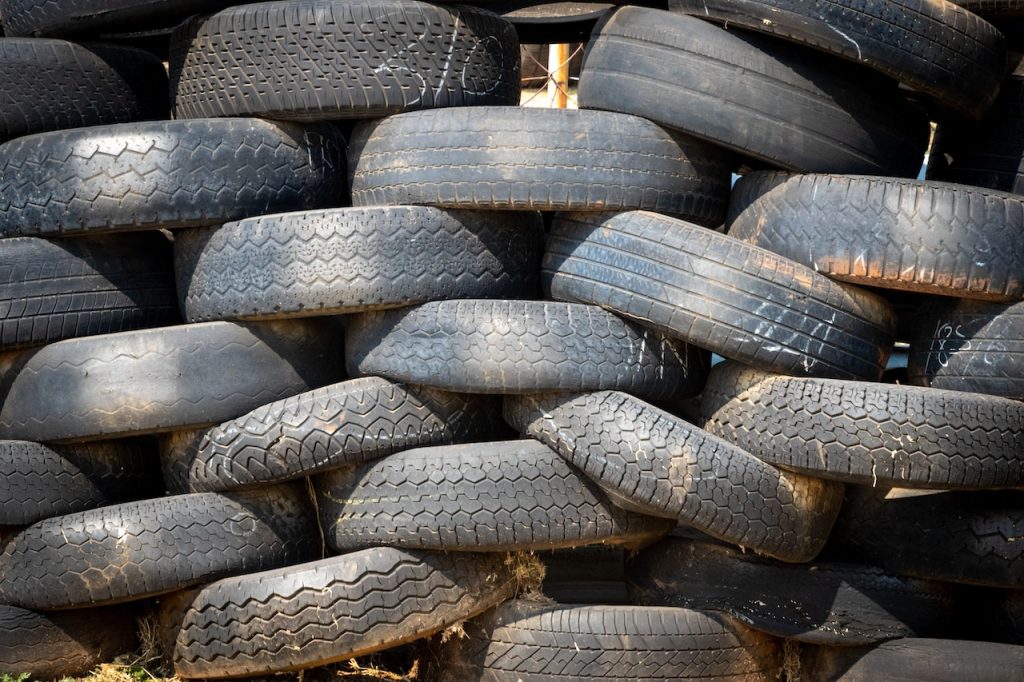 Toxic chemicals found in tires are now being replaced with natural alternatives. Image of worn out, used tires. 
