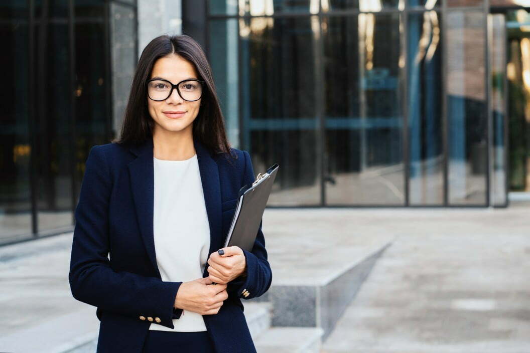 portrait of young successful businesswoman wearing glasses and looking to camera professional female t20 bA0NWB How to Reduce the Carbon Footprint of Your Business 